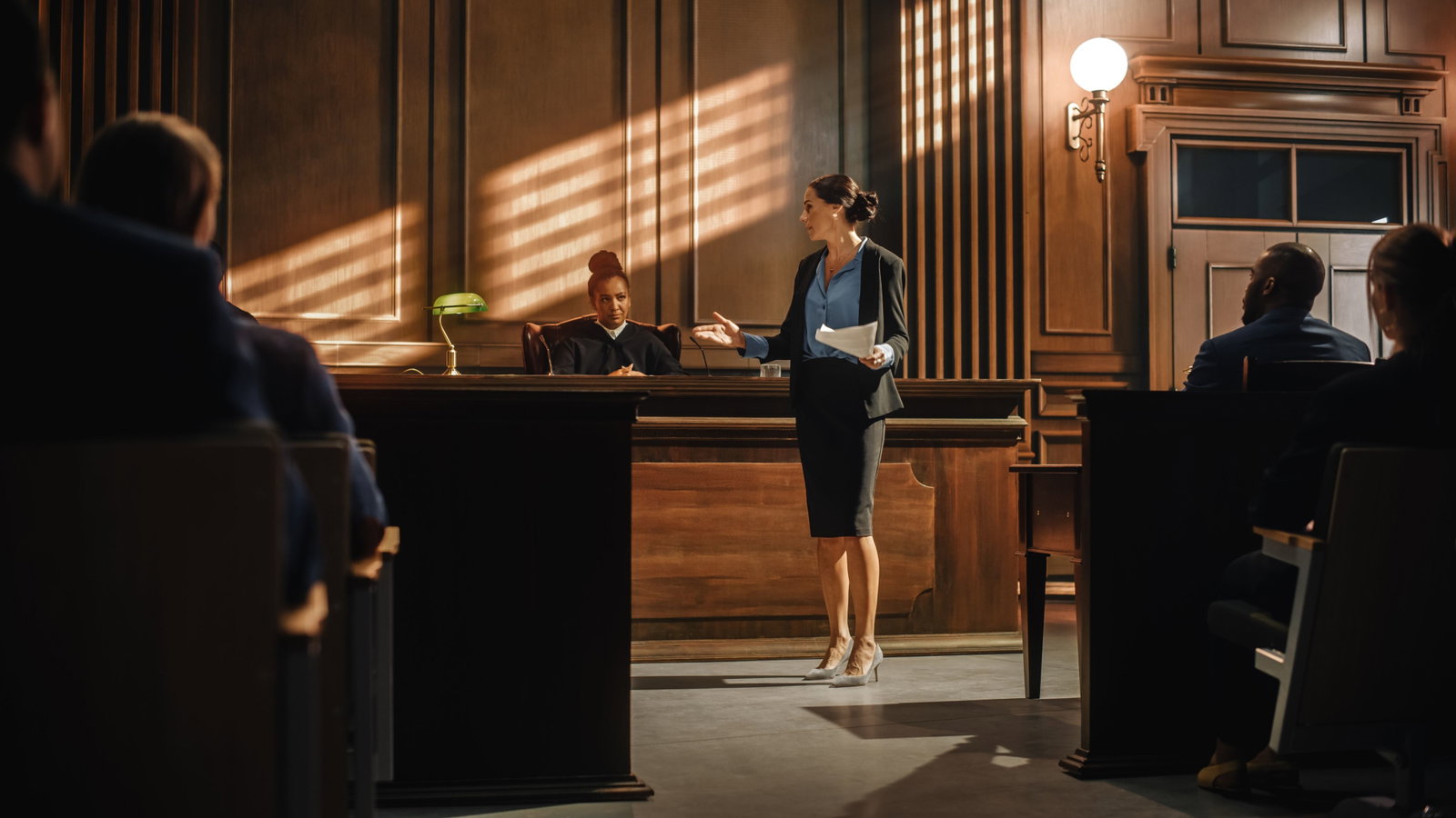 Court of Justice and Law Trial: Successful Female Prosecutor Presenting the Case, Making Passionate Speech to Judge, Jury. Attorney Lawyer Protecting Client with Closing Not Guilty Arguments.