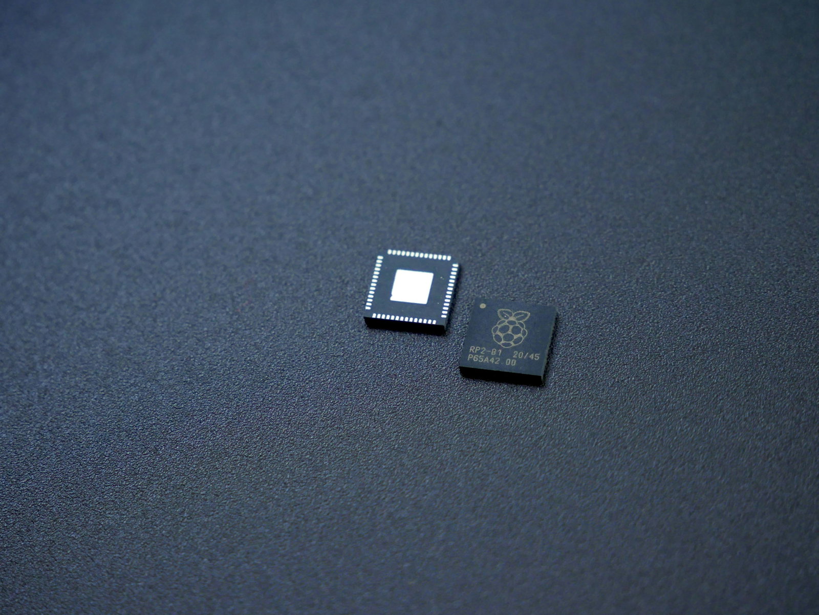 a couple of microchips sitting on top of a table