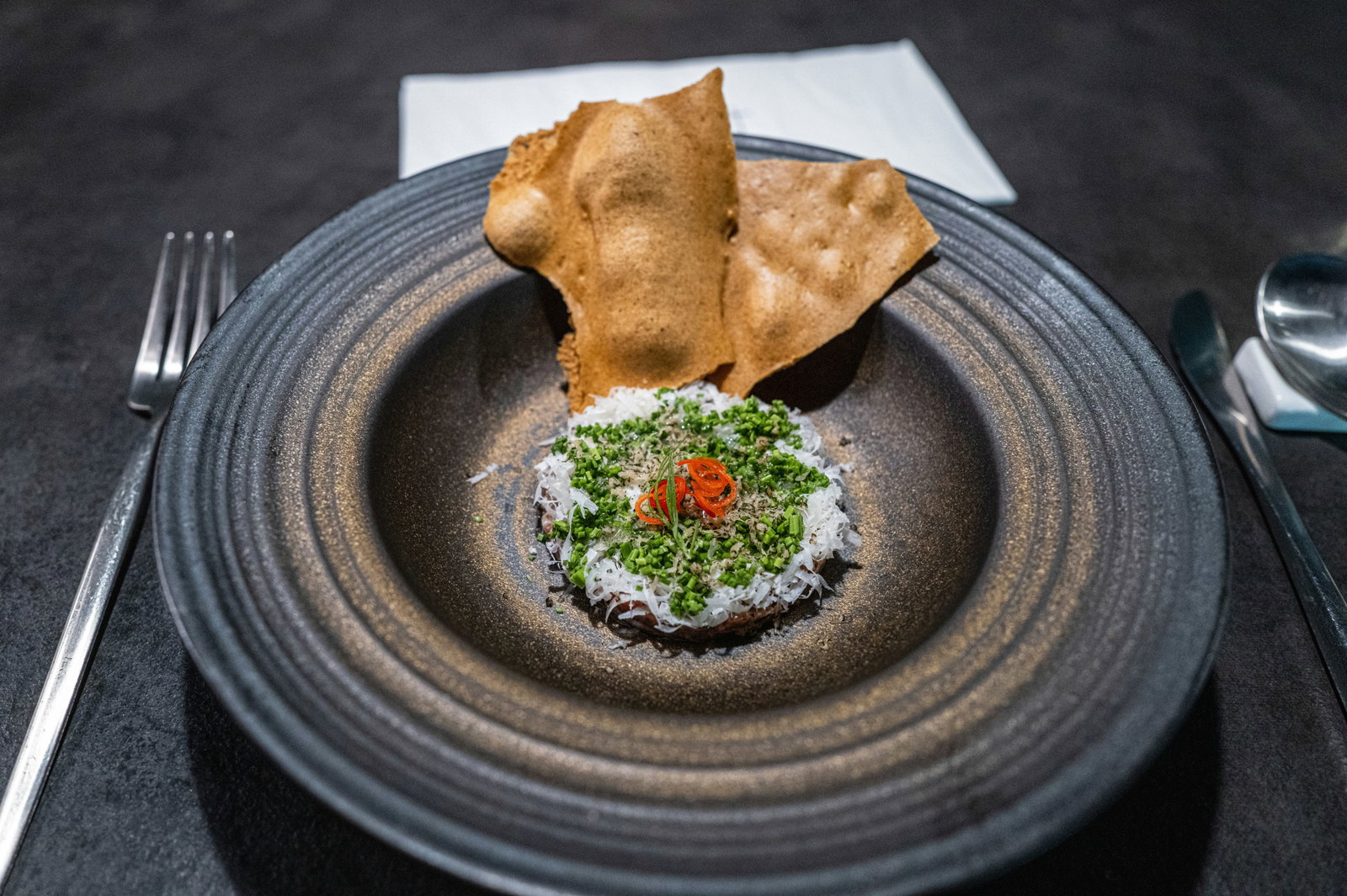 a plate with a small appetizer on top of it